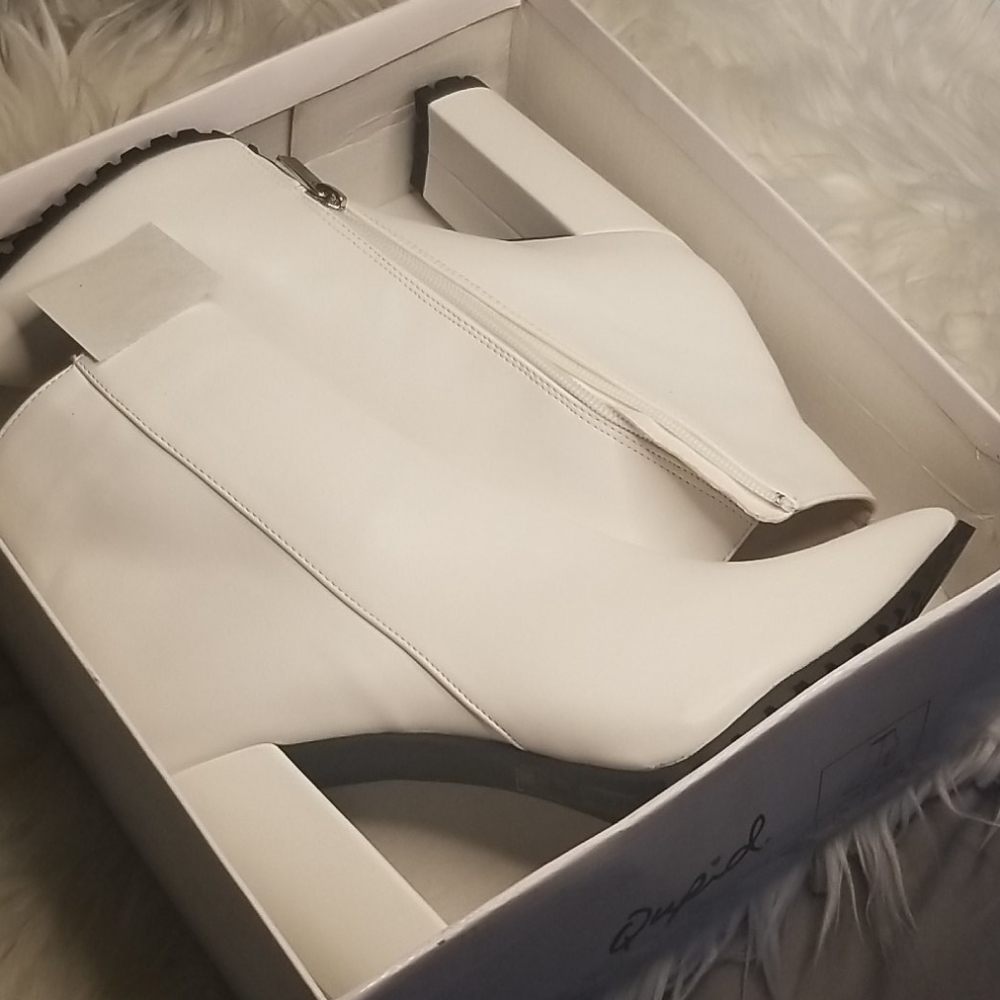 Beautiful white booties by Qupid